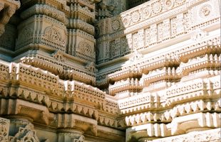 A close up of a building with sculptures on it