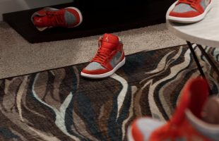 a couple of red shoes sitting on top of a rug